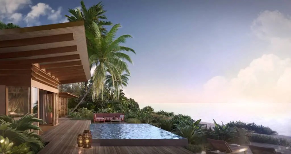 Luxuriöse Strandvilla mit Pool, Palmen und Meerblick bei Sonnenuntergang