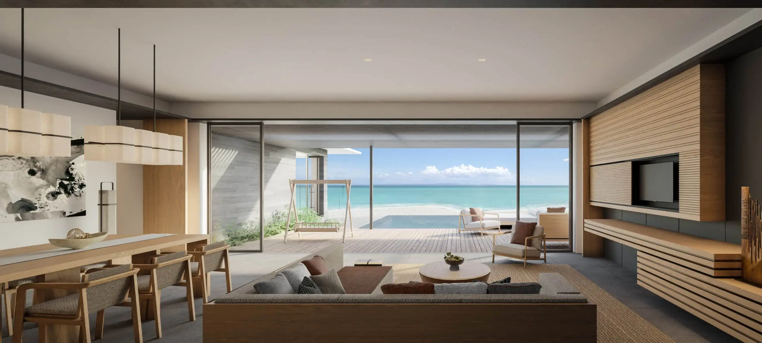 Geräumige Two Bedroom Beach Pool Villa im ALILA mit Meerblick durch große Fenster. Helle, moderne Einrichtung mit Holzelementen und bequemen Möbeln. Außenbereich mit Pool und Strandzugang.